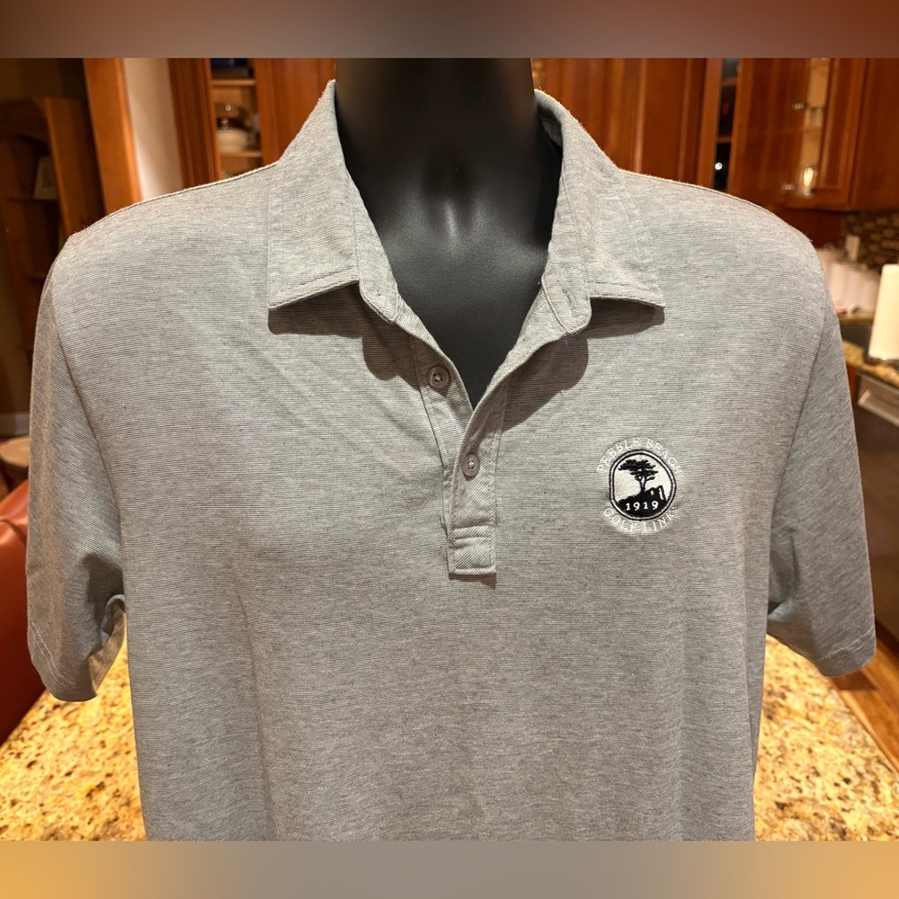 Travis Mathew men’s Pebble Beach golf polo. Sharp grey w/iconic PB‎ logo.
